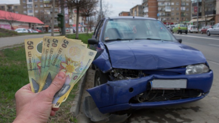 Photo <a href="https://www.dreamstime.com/damaged-vehicle-car-accident-parked-roadside-car-insurance-concept-romanian-money-lei-cost-car-image172157702">172157702</a> © 
<a href="https://www.dreamstime.com/scottcod_info">Aron M</a> | <a href="https://www.dreamstime.com/photos-images/car-insurance.html">Dreamstime.com</a>