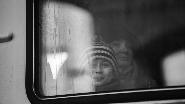 Photo <a href="https://www.dreamstime.com/ukrainian-refugees-lviv-railway-station-waiting-train-to-escape-europe-ukraine-march-image242861829">242861829</a> © 
<a href="https://www.dreamstime.com/rulangaror1983_info">Ruslan Lytvyn</a> | <a href="https://www.dreamstime.com/photos-images/migrants-europe.html">Dreamstime.com</a>